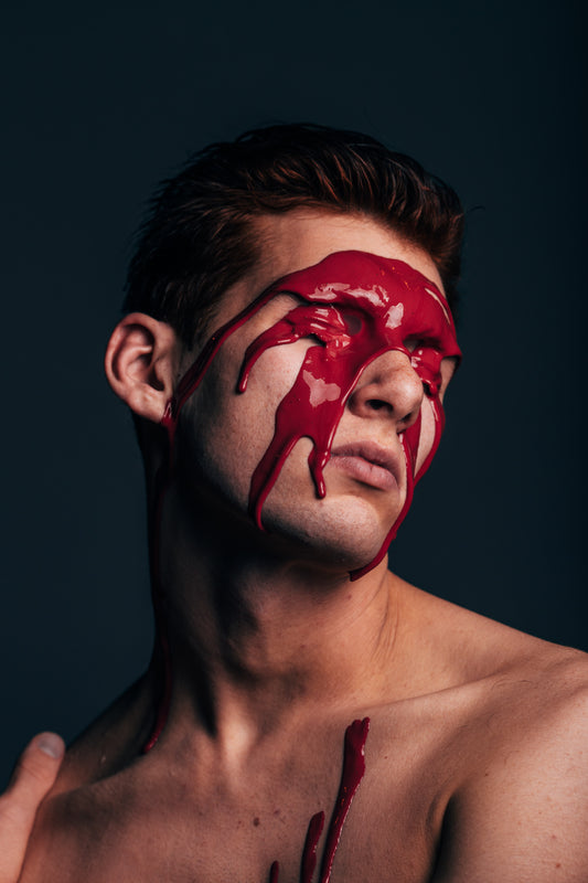 man with paint dripping down from his head. very artsy and aesthetic